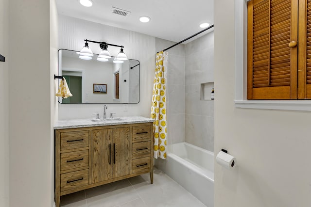 bathroom featuring vanity, tile patterned flooring, and shower / bath combo with shower curtain