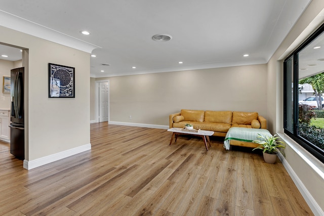 sitting room featuring light hardwood / wood-style flooring