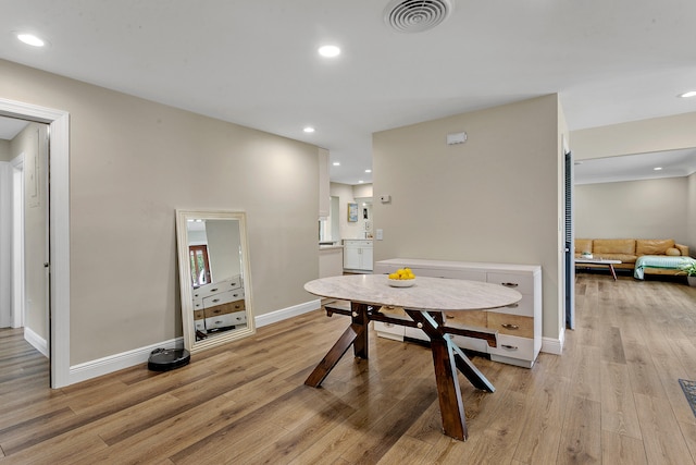 dining room with light hardwood / wood-style flooring