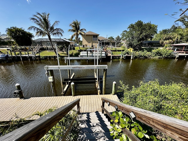 dock area featuring a residential view, a water view, and boat lift