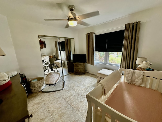 tiled bedroom featuring a ceiling fan