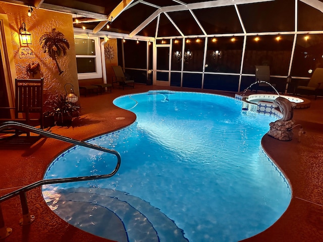 view of swimming pool featuring a pool with connected hot tub, glass enclosure, and a patio