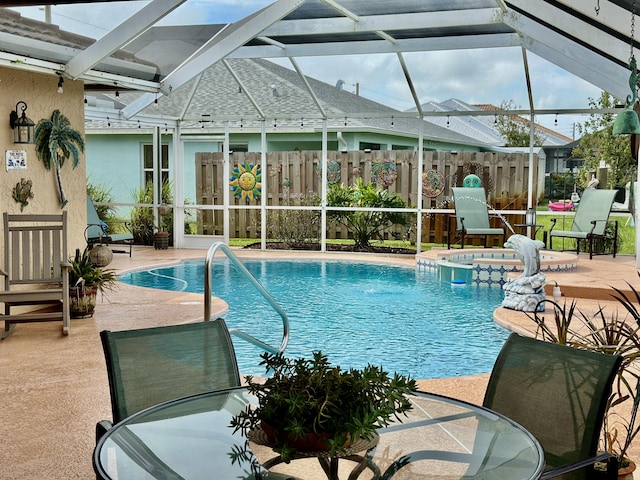 view of swimming pool with outdoor dining area, a patio area, and fence