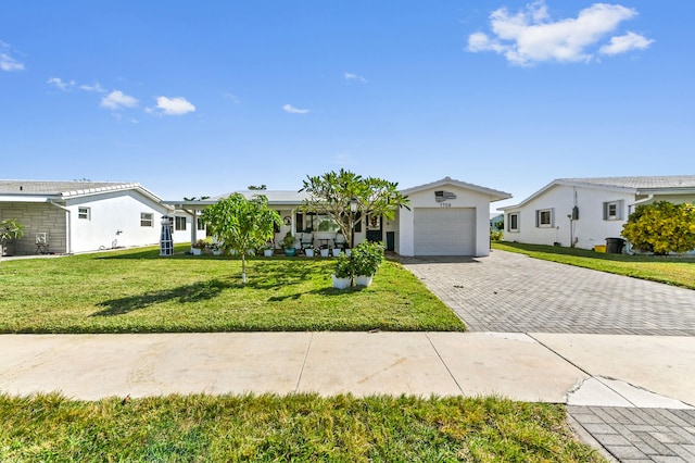 ranch-style home featuring a garage and a front yard