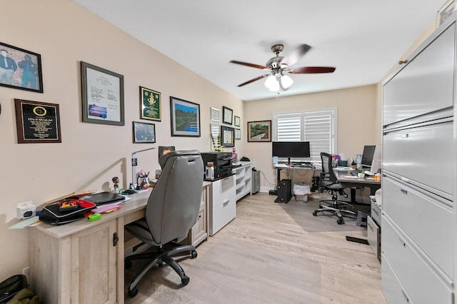 home office featuring ceiling fan and light wood-type flooring