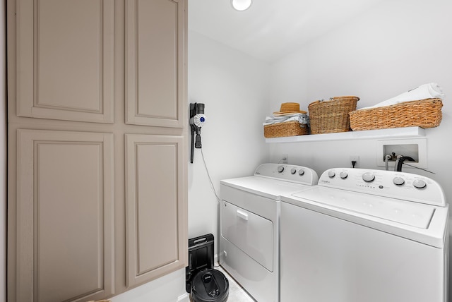 laundry area with washing machine and clothes dryer