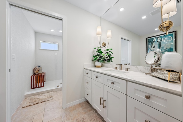 bathroom with a shower and vanity