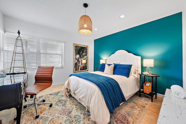 bedroom with light hardwood / wood-style floors