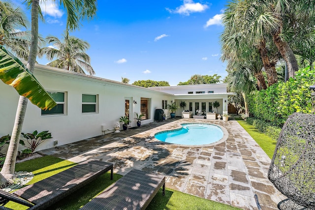 view of swimming pool with a patio