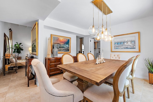 dining space featuring a notable chandelier