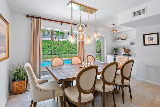 tiled dining area featuring plenty of natural light