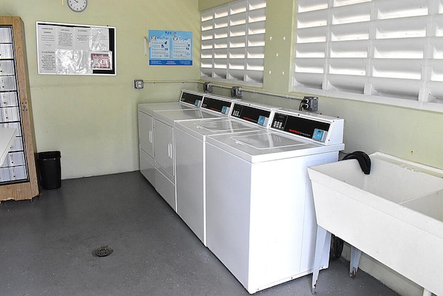 laundry room featuring washing machine and dryer and sink