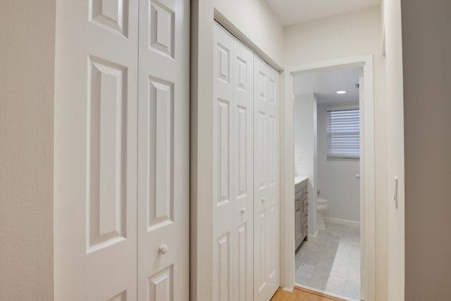 hall with light wood-type flooring