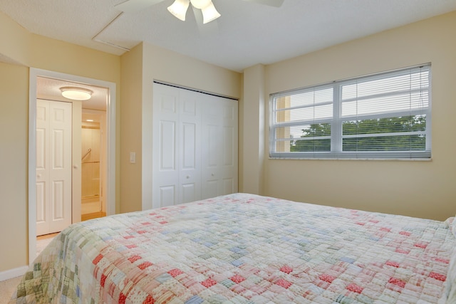 bedroom featuring a closet, carpet flooring, and ceiling fan