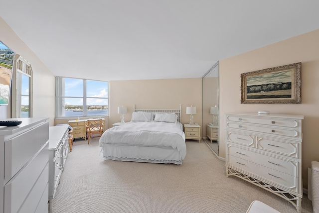 bedroom with light colored carpet