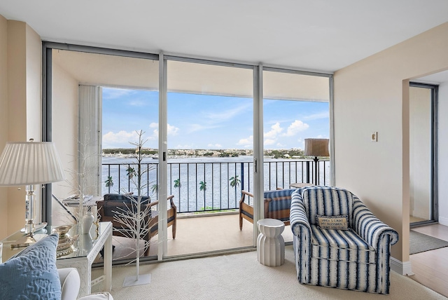 sunroom / solarium with a water view