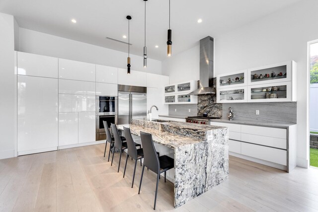 dining area with an inviting chandelier and light hardwood / wood-style floors