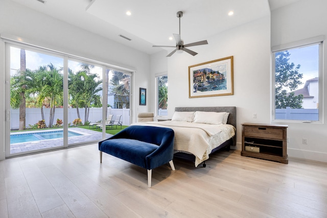 bedroom with ceiling fan, light hardwood / wood-style floors, and access to exterior