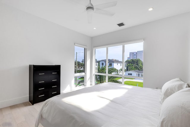 bedroom featuring light hardwood / wood-style floors and ceiling fan