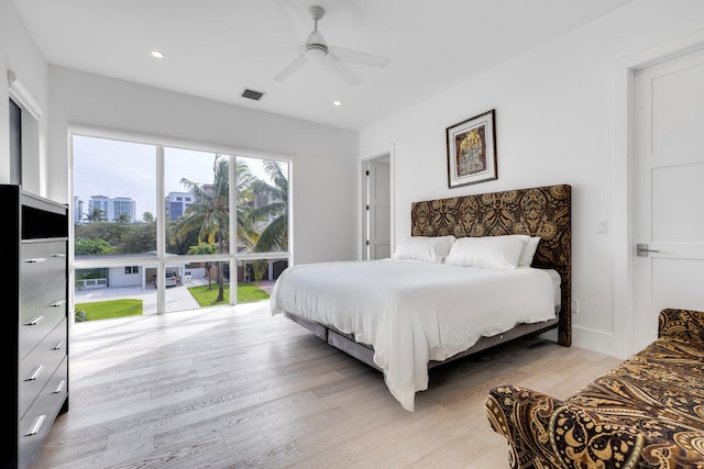 bedroom with light wood-type flooring and ceiling fan