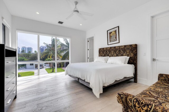 bedroom featuring light hardwood / wood-style floors and ceiling fan