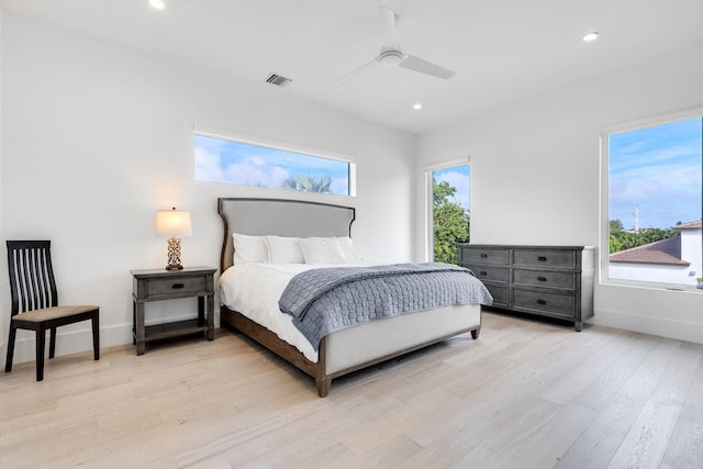 bedroom featuring ceiling fan and light hardwood / wood-style flooring