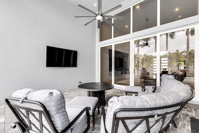 view of patio featuring ceiling fan