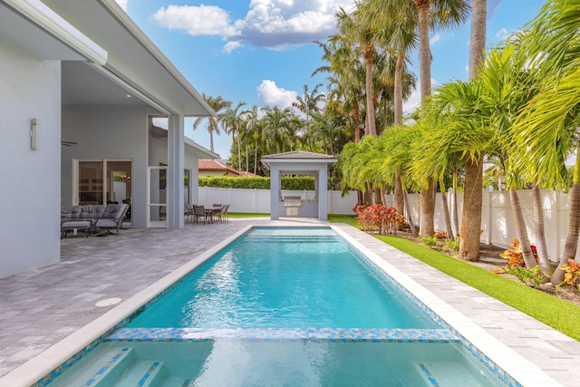 view of swimming pool with a patio area