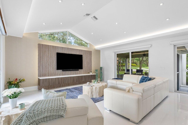 living room with a healthy amount of sunlight and lofted ceiling