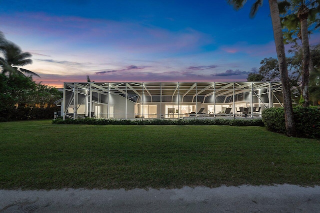 exterior space featuring a yard and a lanai