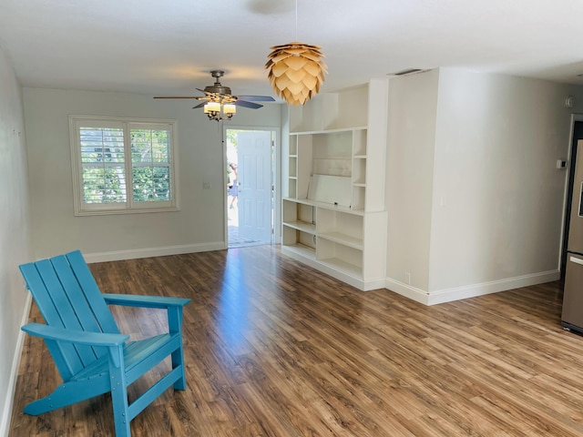 unfurnished room with hardwood / wood-style floors and ceiling fan