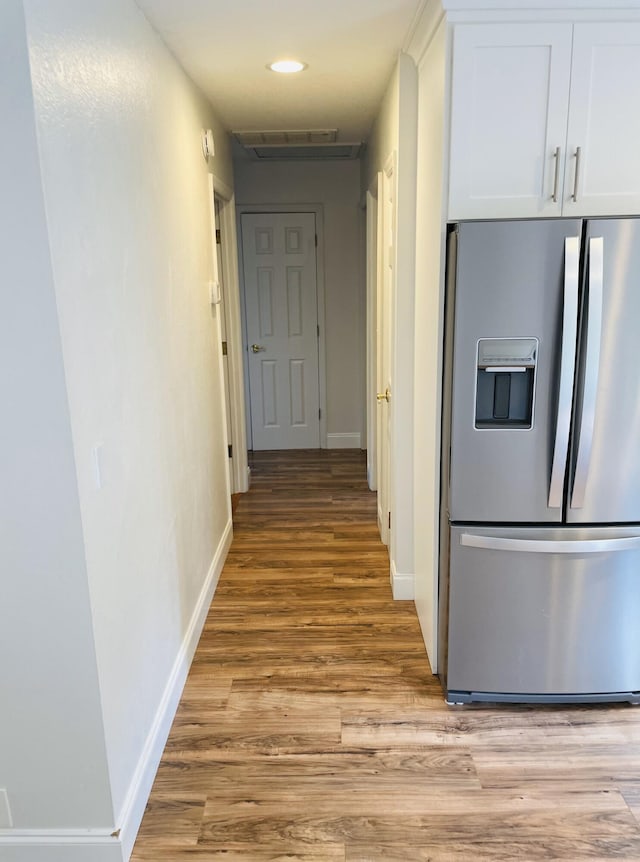 hallway featuring light hardwood / wood-style flooring