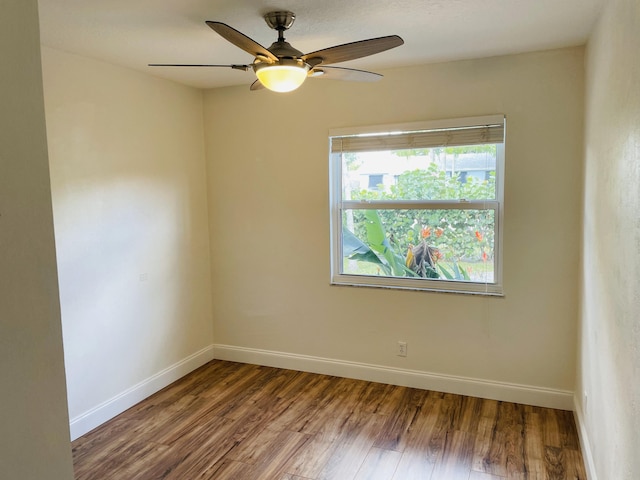 empty room featuring wood-type flooring and ceiling fan