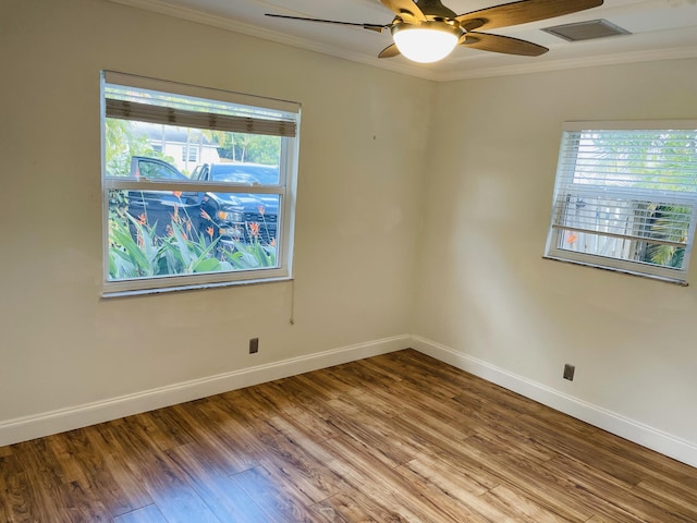 unfurnished room with ornamental molding, hardwood / wood-style floors, and ceiling fan