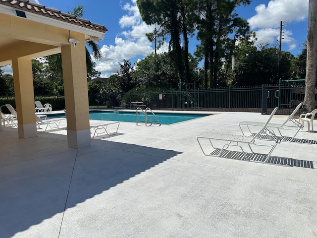 view of pool featuring a patio