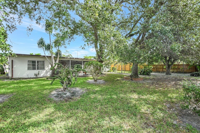 single story home with a carport and a front yard