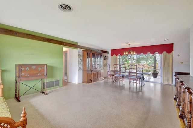 dining area with an inviting chandelier