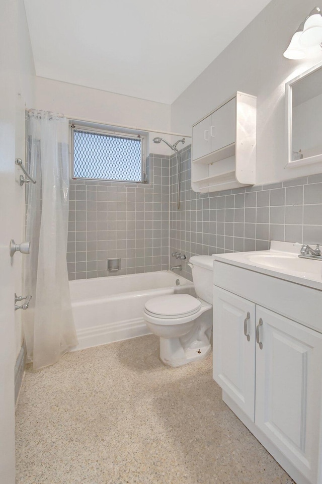 full bathroom featuring vanity, shower / bath combination with curtain, decorative backsplash, toilet, and tile walls