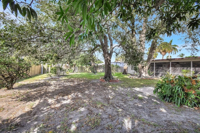 view of yard with a sunroom