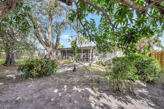 view of yard with a sunroom