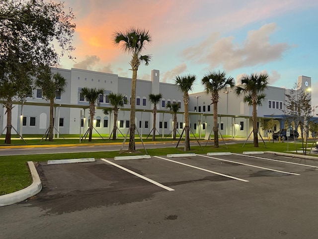 view of parking at dusk