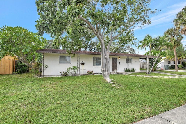 ranch-style house featuring a front lawn