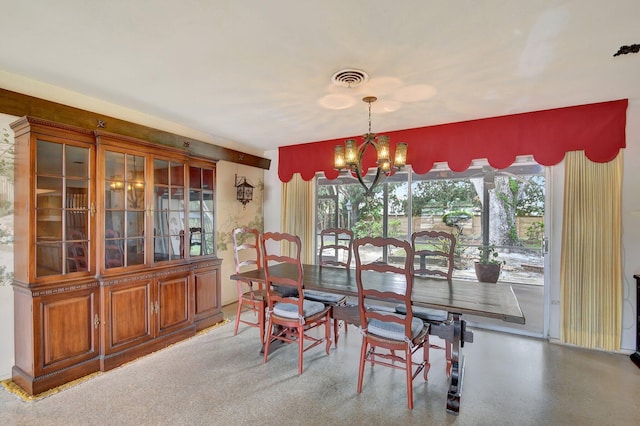 dining room featuring a chandelier