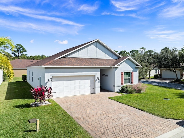 ranch-style house featuring a garage, roof with shingles, decorative driveway, a front yard, and stucco siding