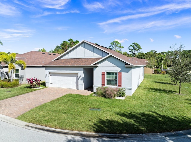 view of front of property featuring a front lawn and a garage