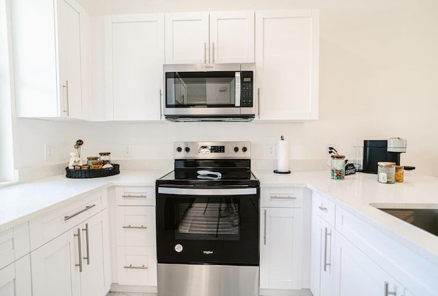 kitchen featuring white cabinetry and stainless steel appliances