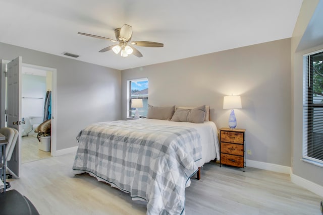 bedroom with light hardwood / wood-style floors, multiple windows, and ceiling fan