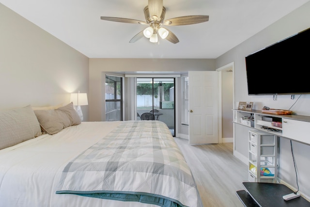 bedroom with access to exterior, light hardwood / wood-style flooring, and ceiling fan