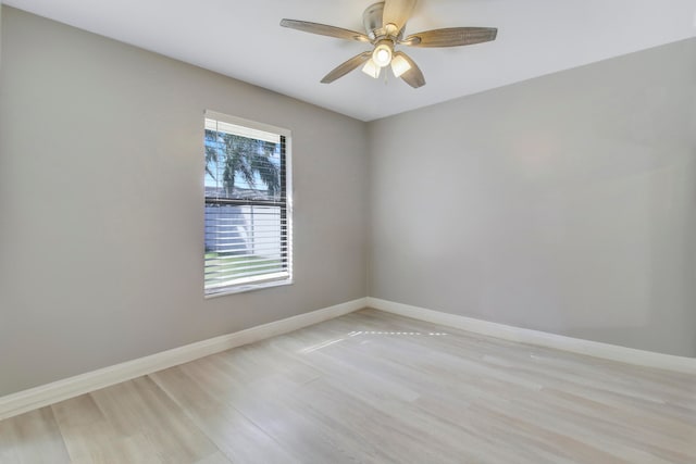 spare room featuring ceiling fan and light wood-type flooring