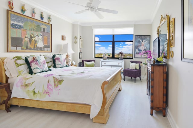 bedroom with ceiling fan, light hardwood / wood-style flooring, and ornamental molding